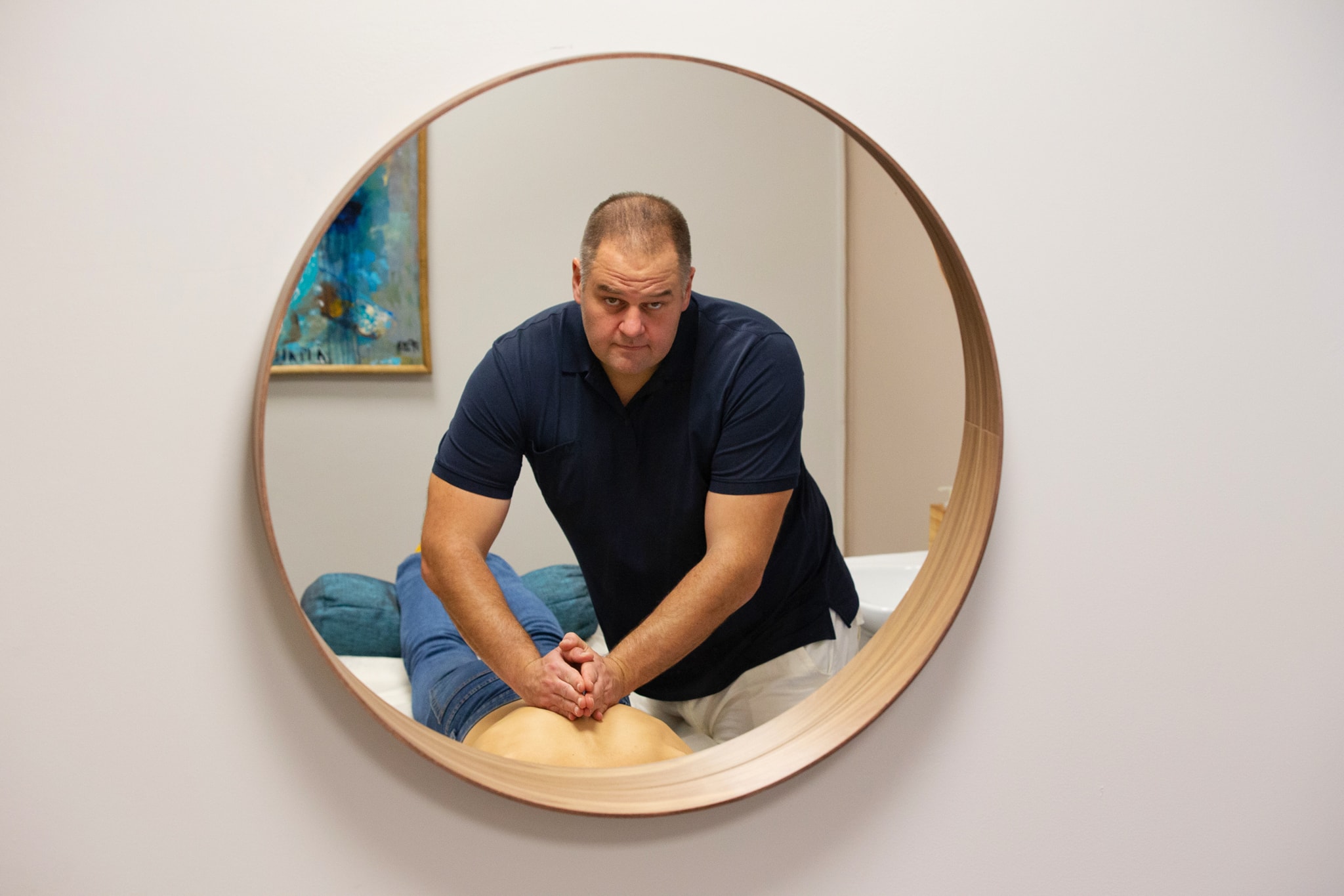 Zborai Tamás portrait as a professional chiropractor in his studio